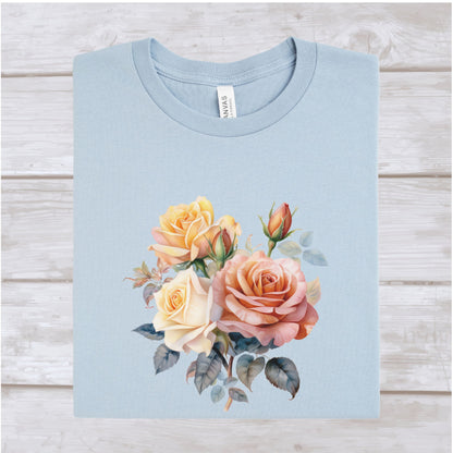 Light blue t-shirt with floral design on a wooden surface