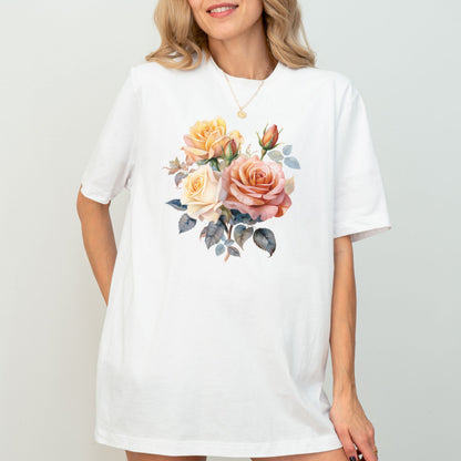 Woman wearing a white t-shirt with a floral design on a plain background