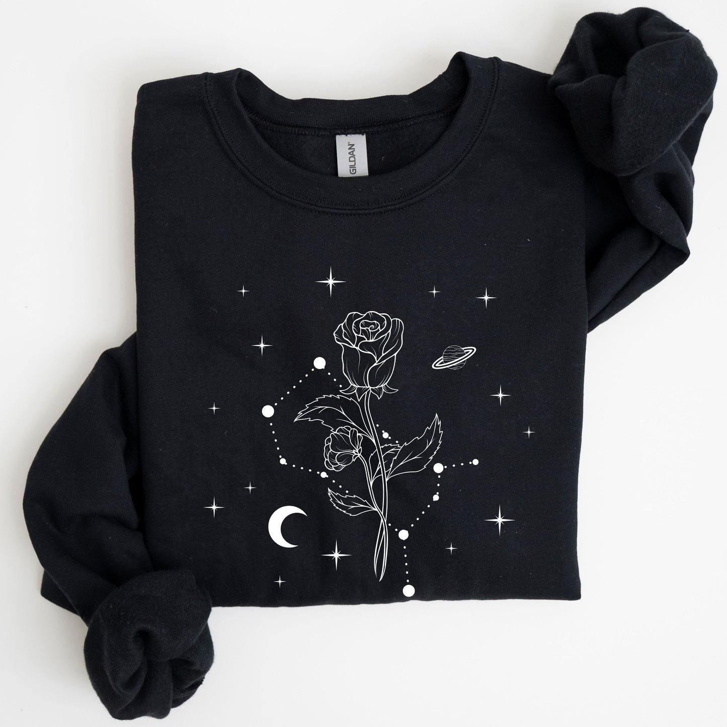 Black sweatshirt with celestial design on a white background