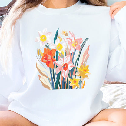 White sweatshirt with colorful floral design worn by a person