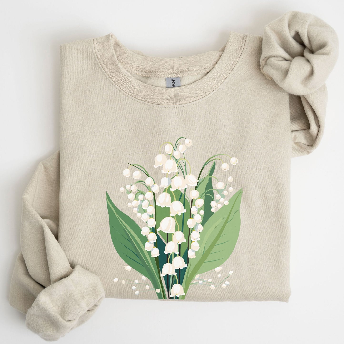 Beige sweatshirt with a floral design on a white background