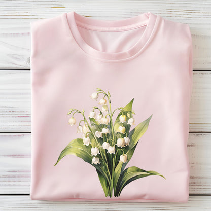 Pink t-shirt with a floral design on a wooden surface