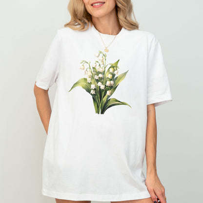 White t-shirt with floral design worn by a model on a plain background