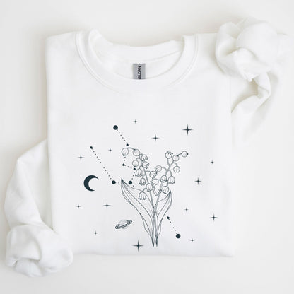 White sweatshirt with black floral and celestial design on a light background