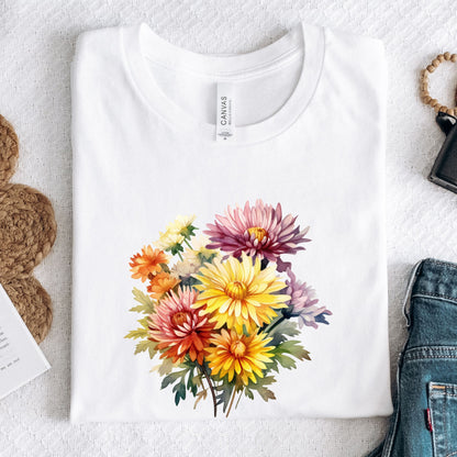 White t-shirt with a colorful floral design on a light gray surface.