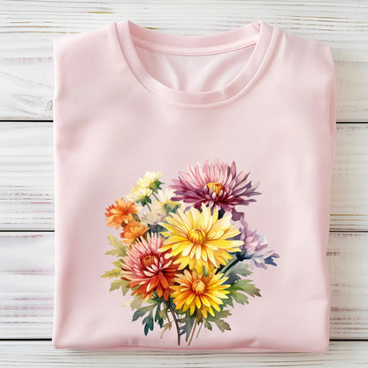 Pink t-shirt with a colorful floral design on a wooden surface