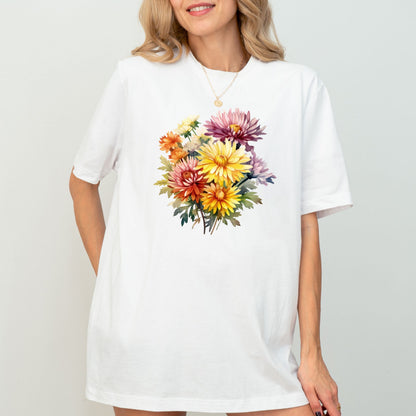 Woman wearing a white t-shirt with a colorful floral design on a plain background