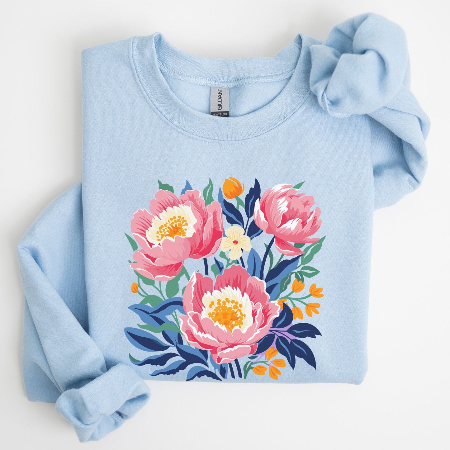 Light blue sweatshirt with floral design on a white background
