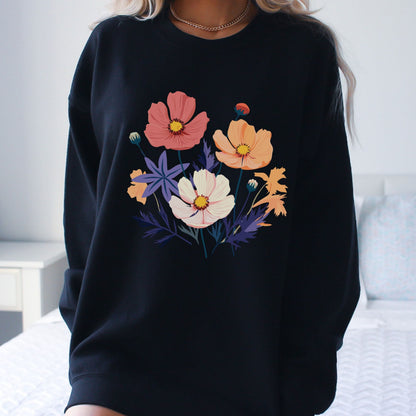 Black sweatshirt with colorful floral design worn by a person.