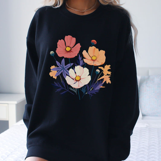 Black sweatshirt with colorful floral design worn by a person.