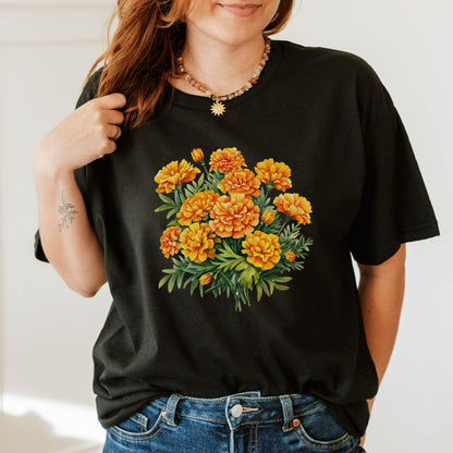 Person wearing a black t-shirt with a floral design on a plain background
