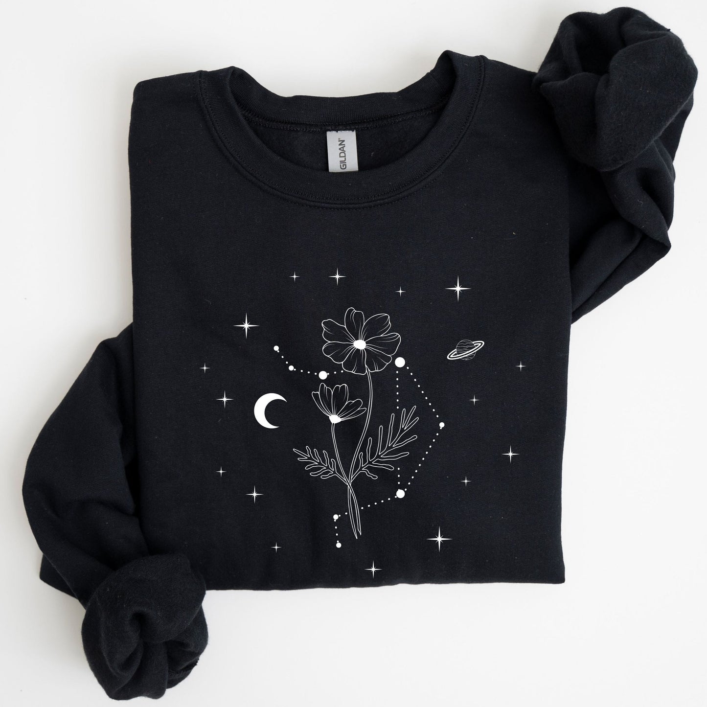 Black sweatshirt with celestial design on a white background