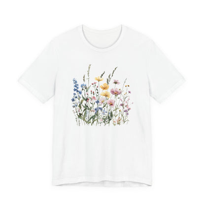 Flat lay of white t-shirt with pastel watercolor wildflowers