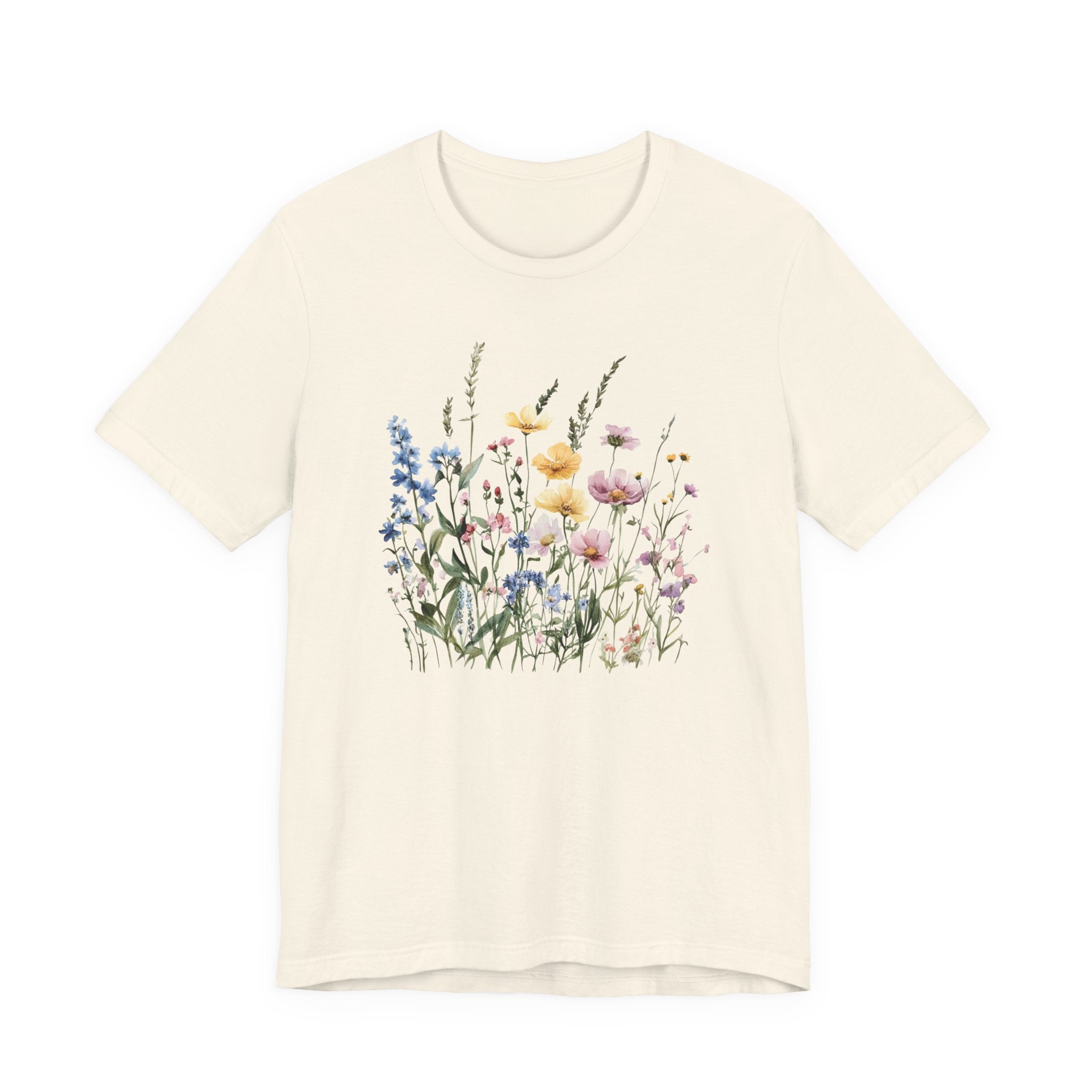 Flat lay of natural t-shirt with pastel watercolor wildflowers