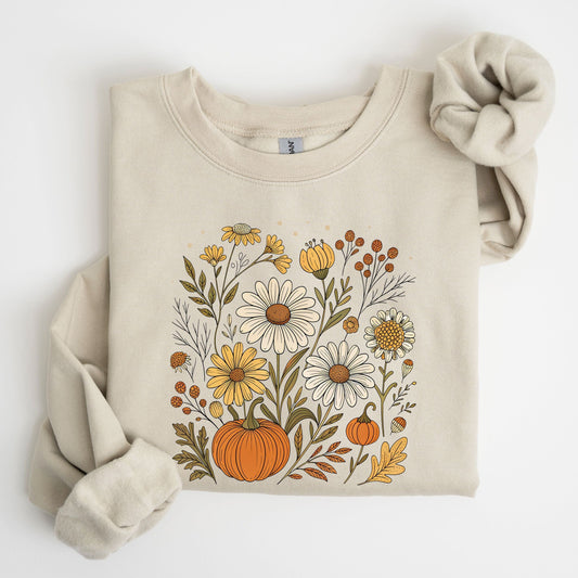 Beige sweatshirt with floral and pumpkin design on a white background