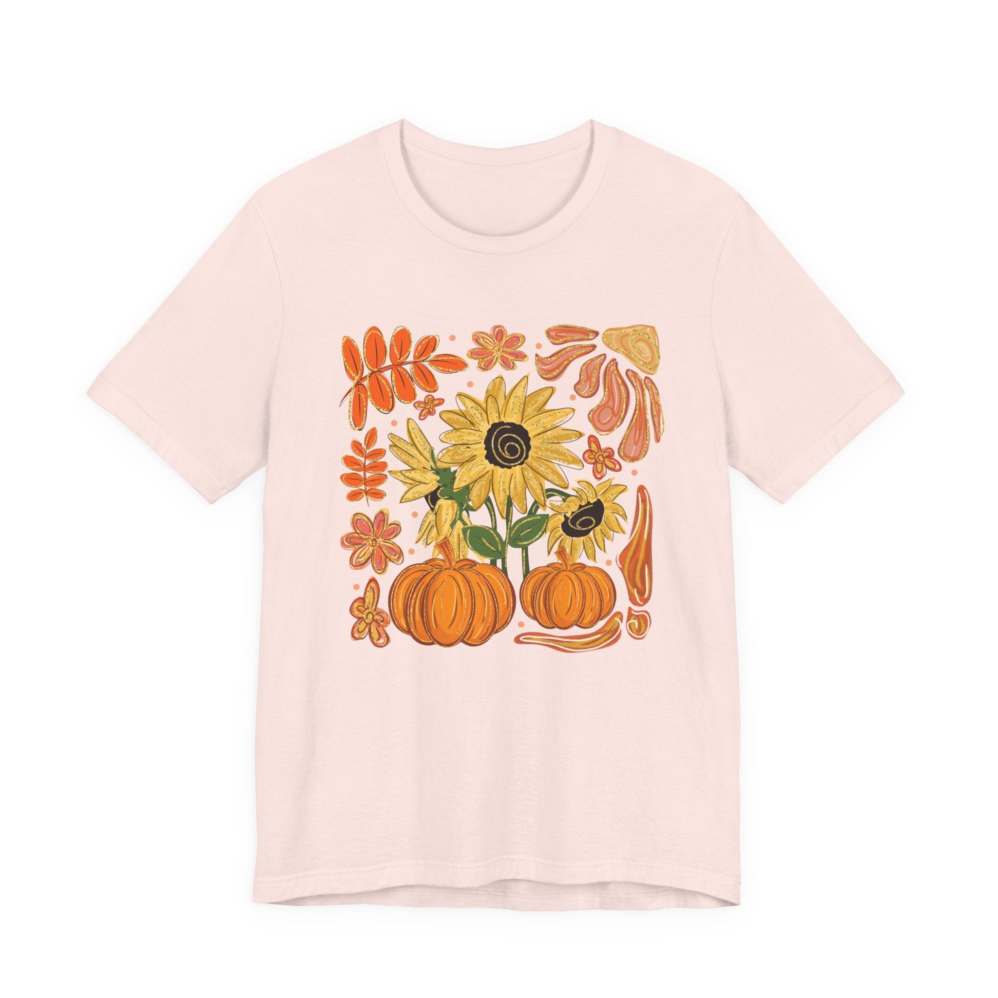 Pink t-shirt with autumn-themed design featuring pumpkins and sunflowers on a white background