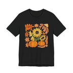 Black t-shirt with autumn-themed design featuring pumpkins, leaves, and sunflowers on a white background.