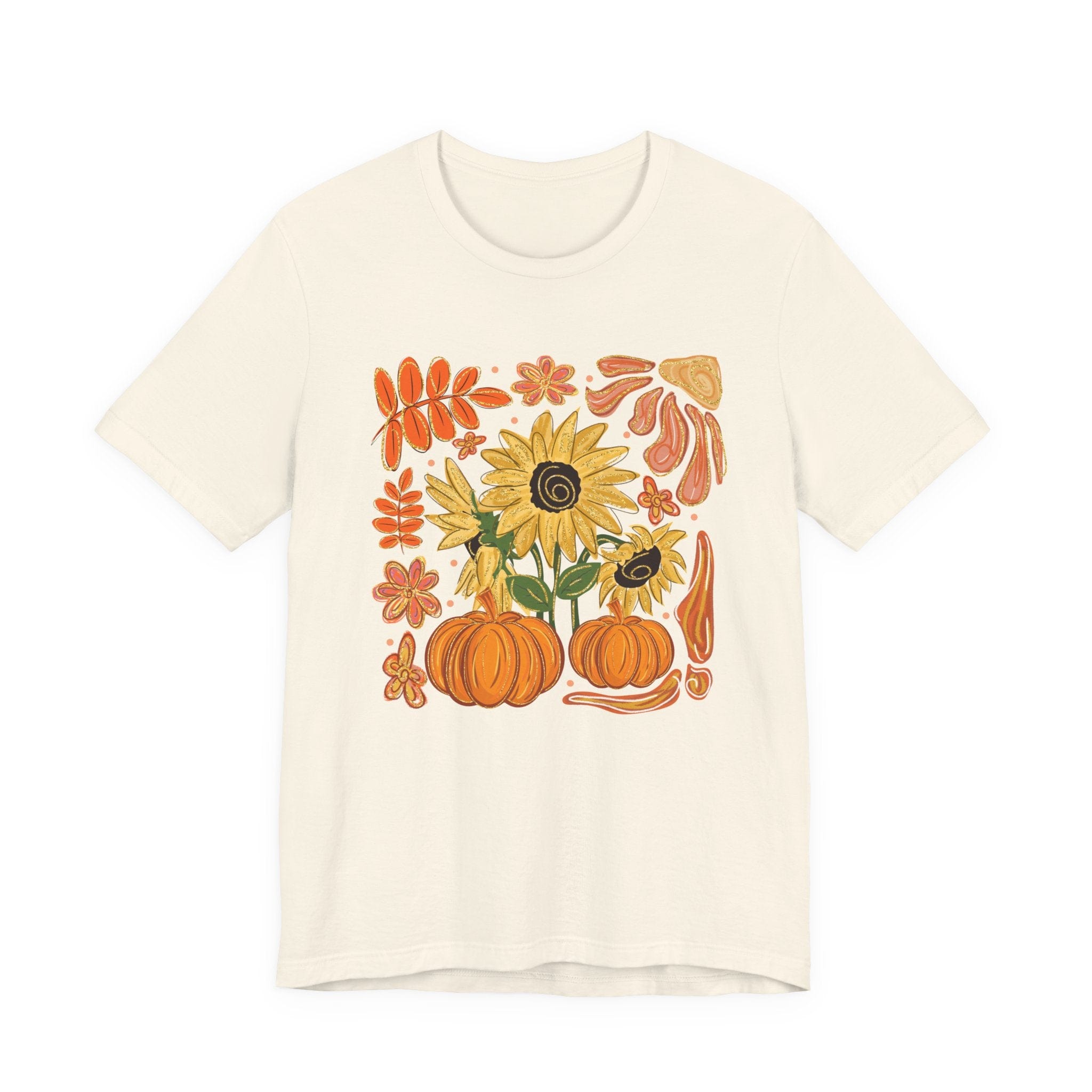 Beige t-shirt with autumn-themed design featuring pumpkins and sunflowers on a white background