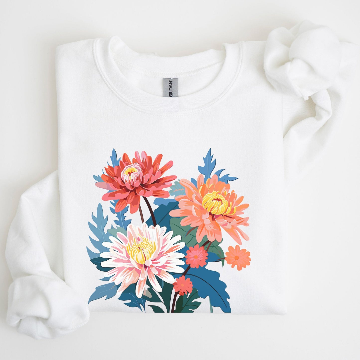 White sweatshirt with colorful floral design on a light background