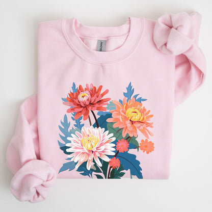 Pink sweatshirt with floral design on a light gray background