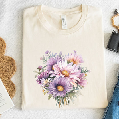 Beige t-shirt with a floral design on a textured surface