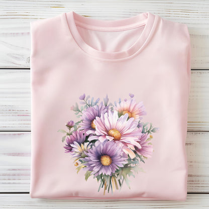 Pink t-shirt with a floral design on a wooden surface