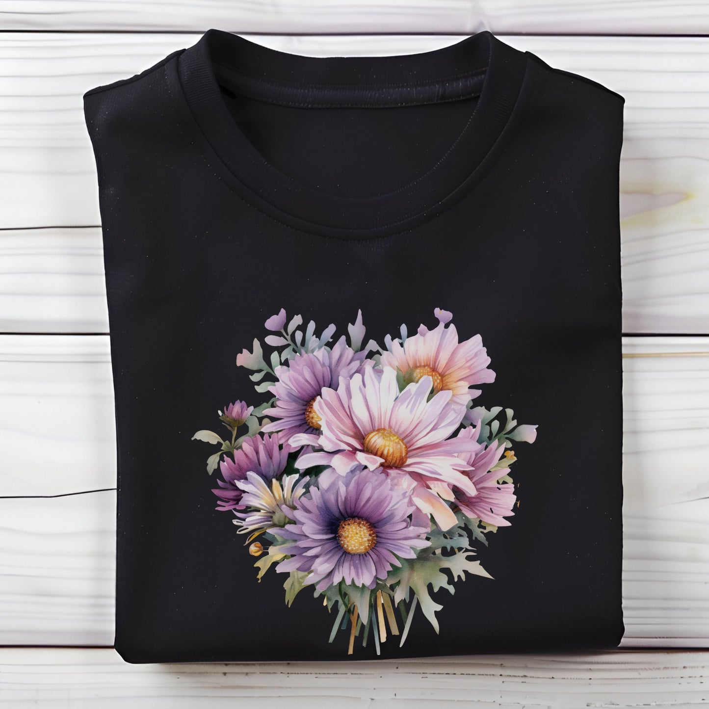 Black t-shirt with a colorful floral design on a wooden surface