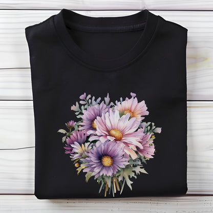 Black t-shirt with a colorful floral design on a wooden surface