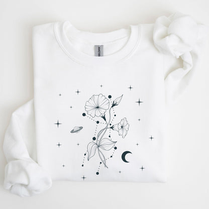 Folded white sweatshirt with a celestial floral design on a white background