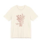 Beige t-shirt with floral design and text on a white background