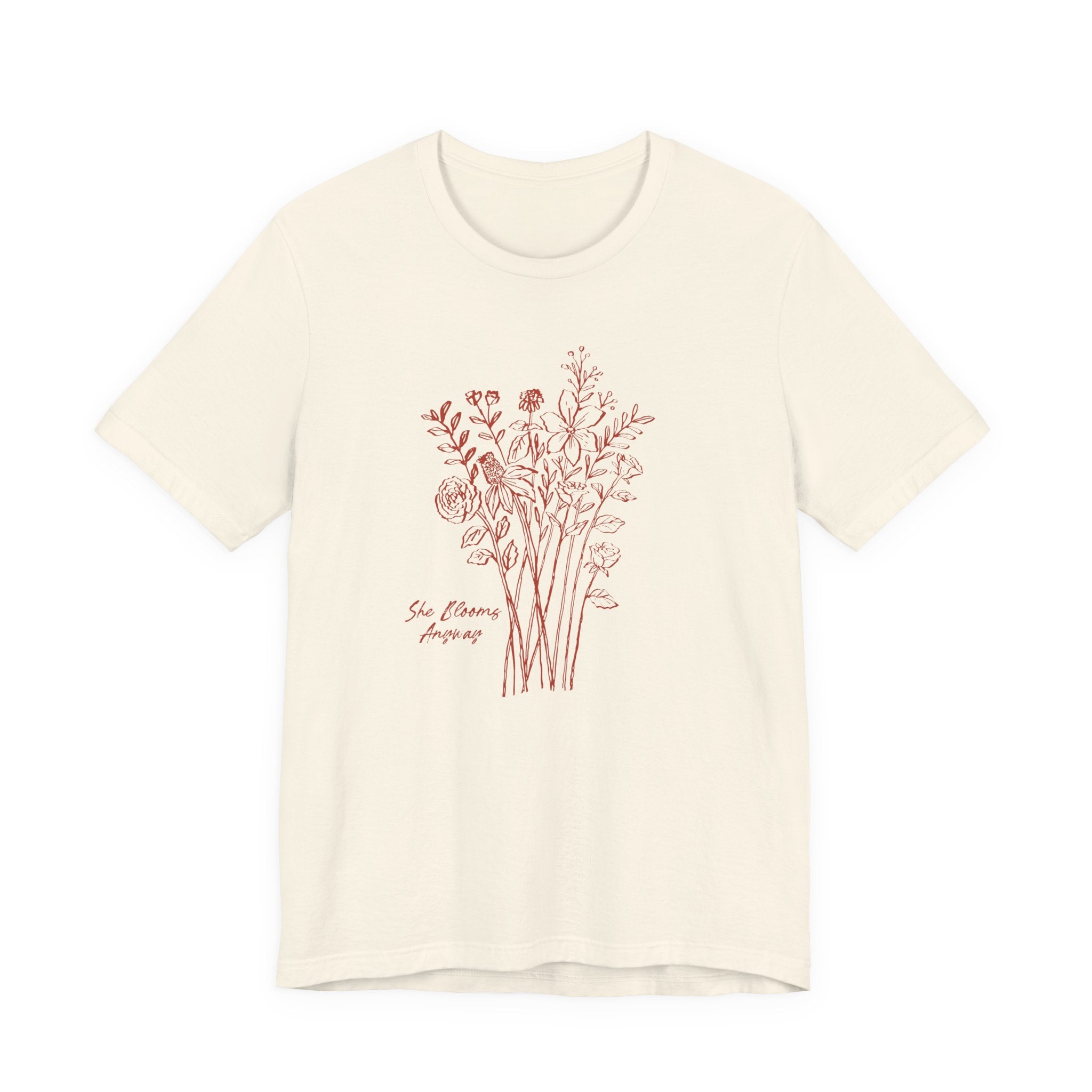 Beige t-shirt with floral design and text on a white background