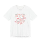 White t-shirt with strawberry and bow design on a white background