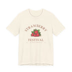 Beige t-shirt with 'Strawberry Festival' graphic on a white background