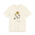 Beige t-shirt with sunflower design on a white background