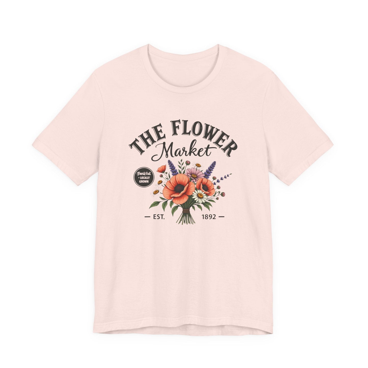 Pink t-shirt with 'The Flower Market' graphic design on a white background