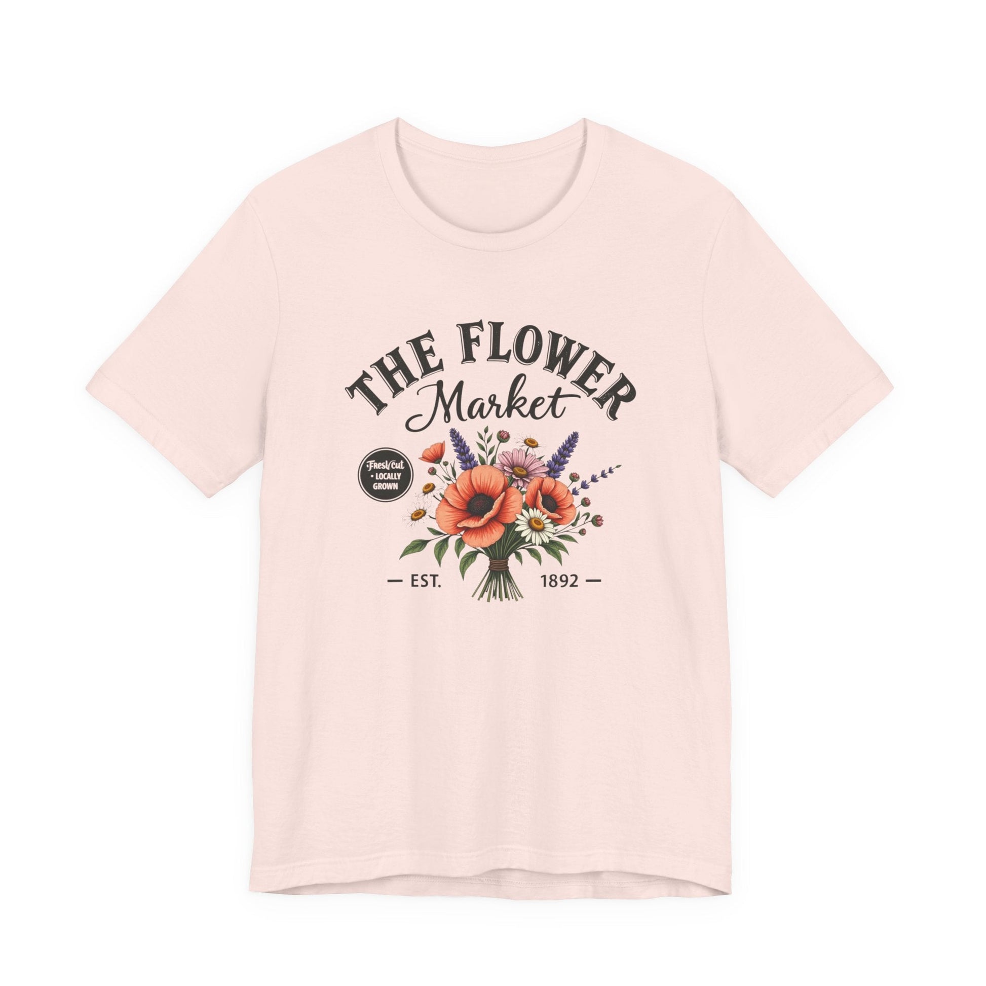 Pink t-shirt with 'The Flower Market' graphic design on a white background