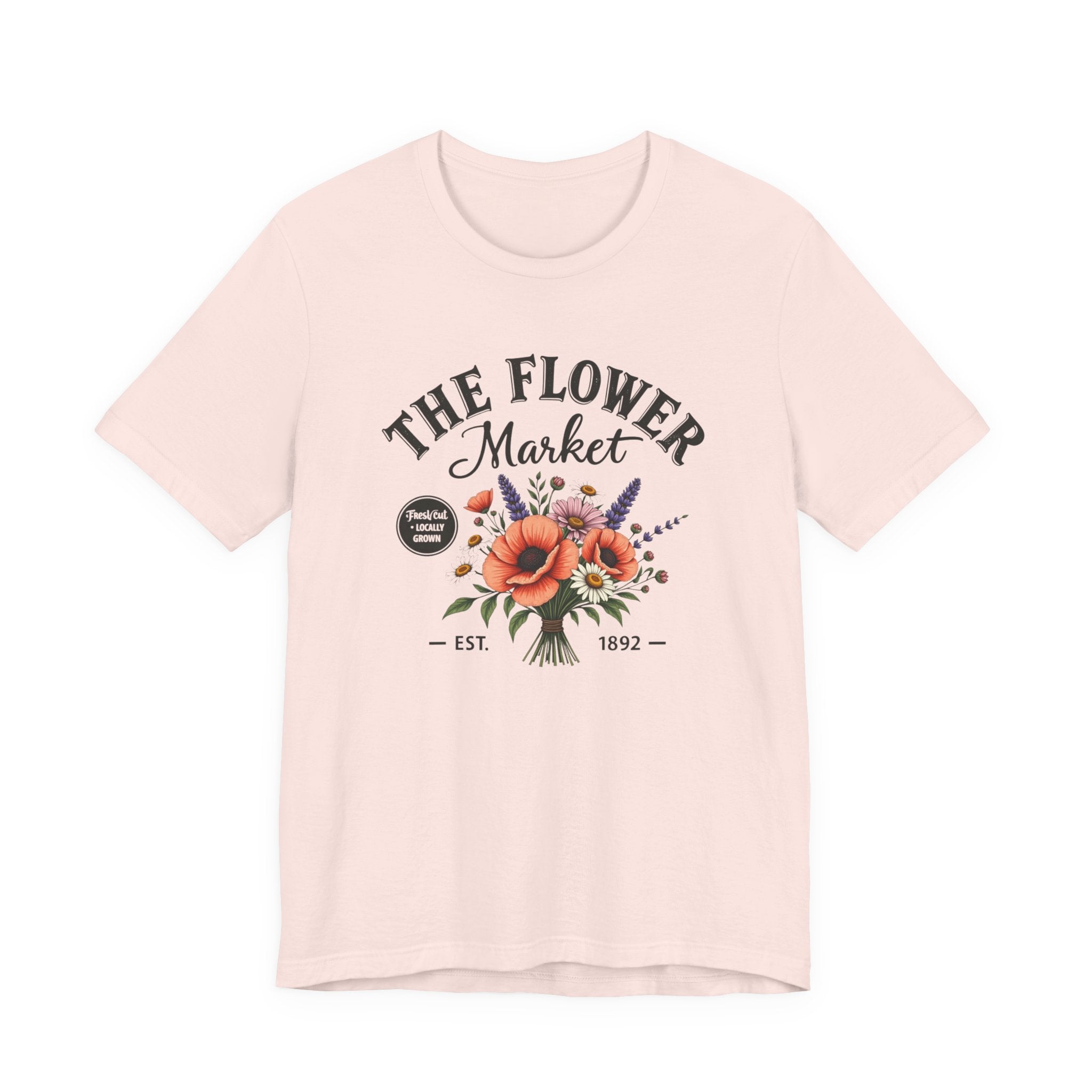Pink t-shirt with 'The Flower Market' graphic design on a white background