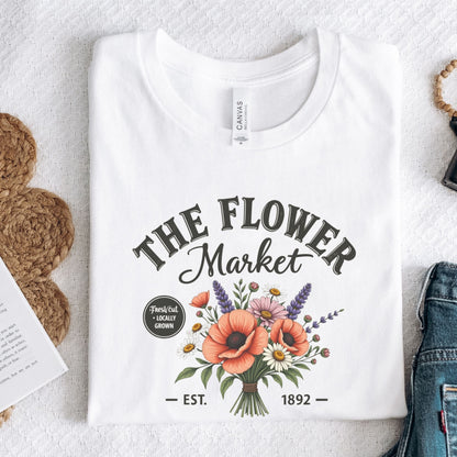White t-shirt with 'The Flower Market' design on a light background