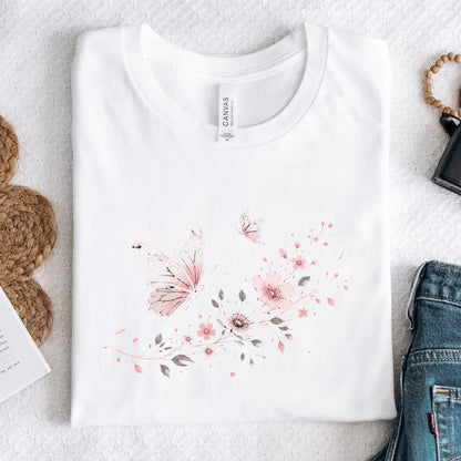 White t-shirt with floral design on a light gray surface