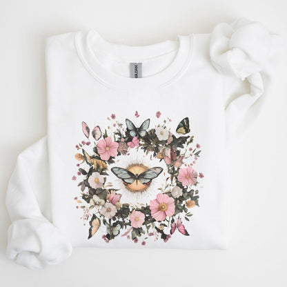 White sweatshirt with a floral and butterfly design on a light background