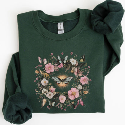 Green sweatshirt with floral and butterfly design on a white background