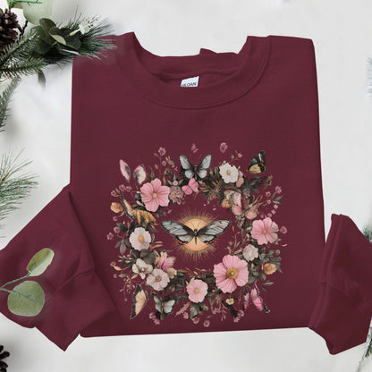 Maroon sweatshirt with floral and butterfly design on a white background