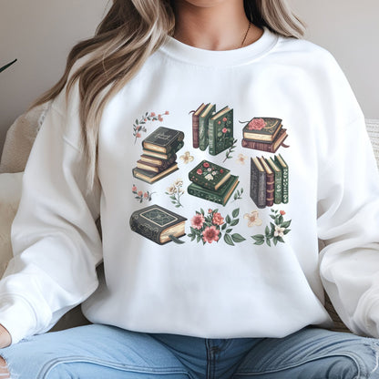 Person wearing a white sweatshirt with book and floral design
