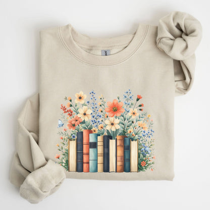 Beige sweatshirt with a design of books and flowers on a white background