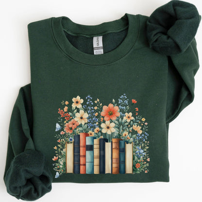 Green sweatshirt with floral and book design on a white background