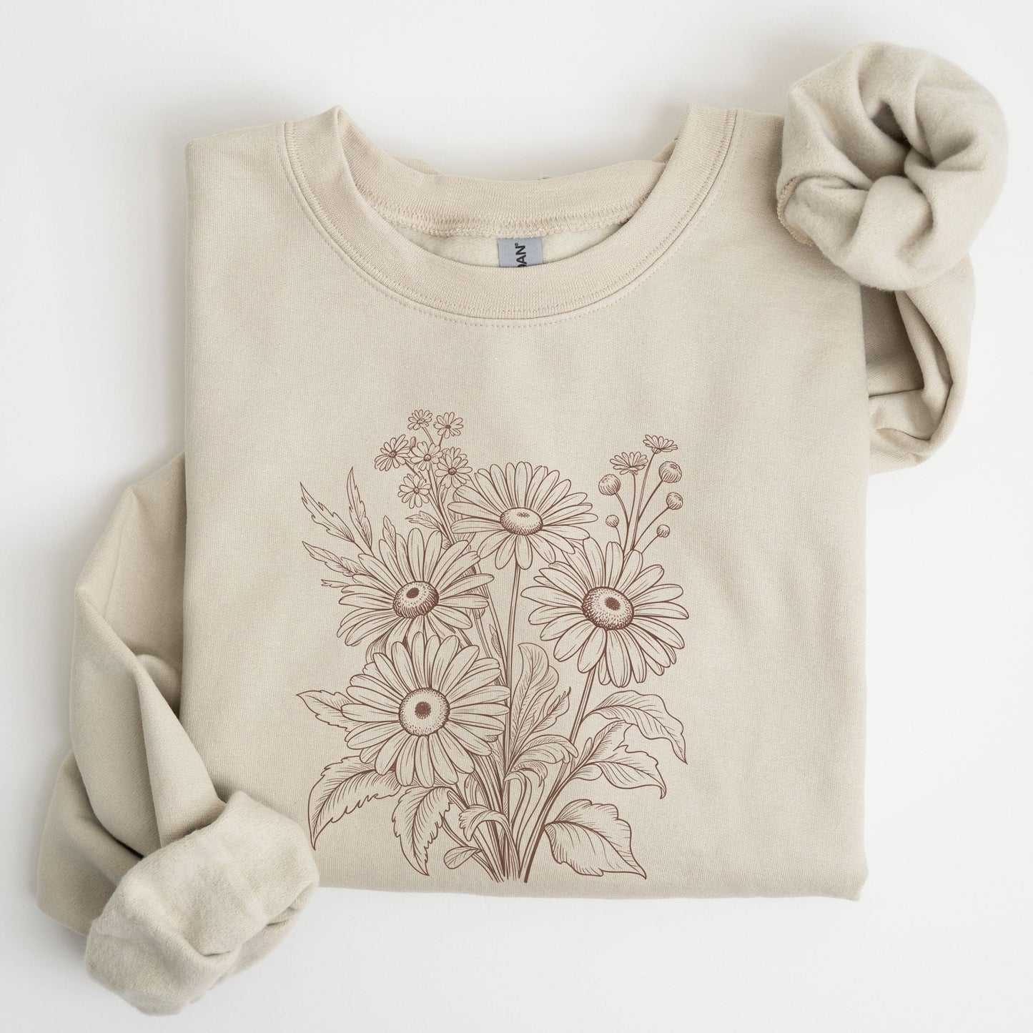 Beige sweatshirt with floral design on a white background