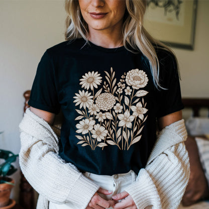 Person wearing a black t-shirt with floral design in a casual setting