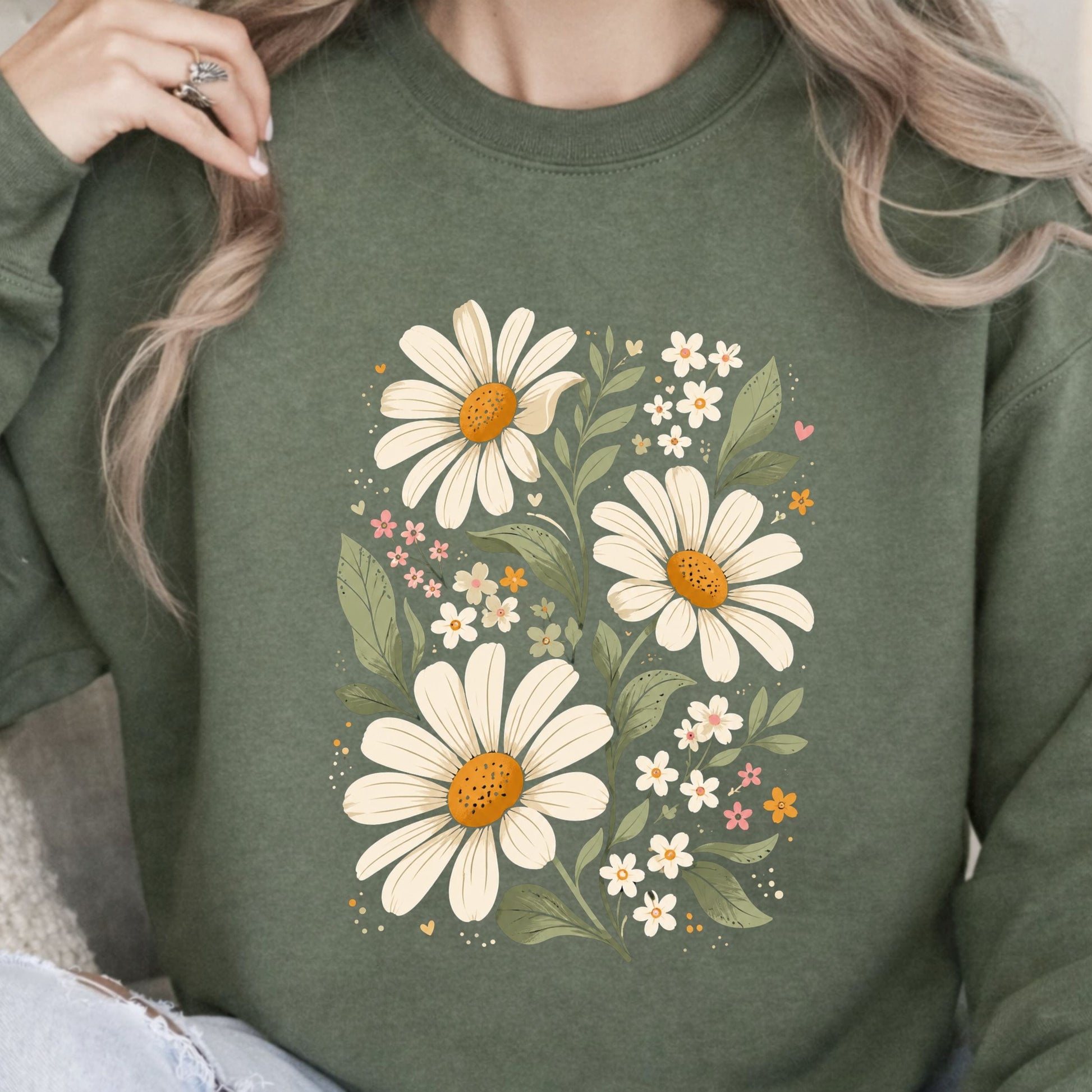 Green sweatshirt with floral design worn by a person