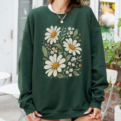 Person wearing a green sweatshirt with floral design outdoors