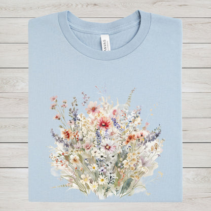 Light blue t-shirt with a floral design on a wooden surface